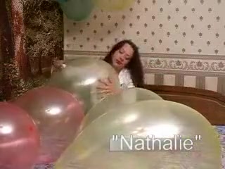 Squeeze balloons to pop