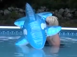 Blue whale inflating in swimming pool