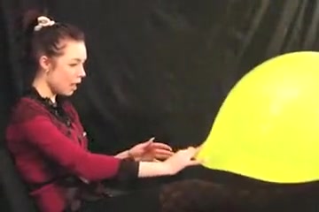 Russian Alissa Blows to Pop Yellow Balloon