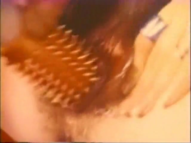 Tina Russell having a great time using a spiky toy