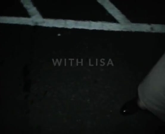 Lisa being pissed on in the car park outdoors.