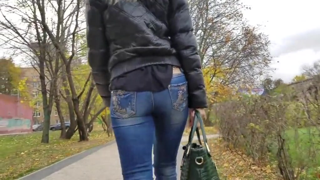Nice blonde with small round ass in jeans at autumn day