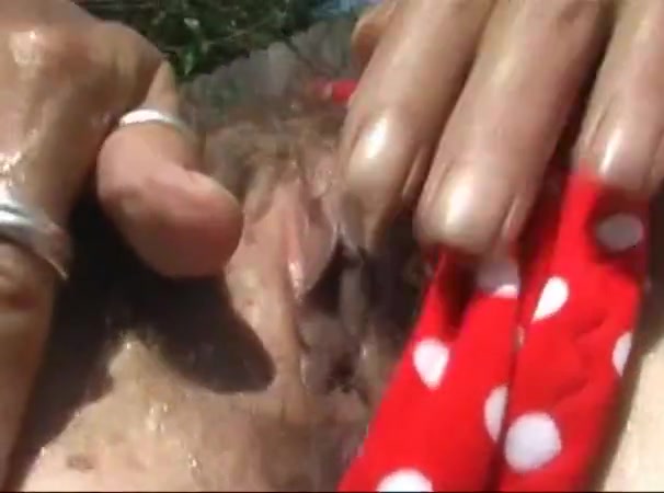 Fingering my hairy wet pussy in the hot florida sun