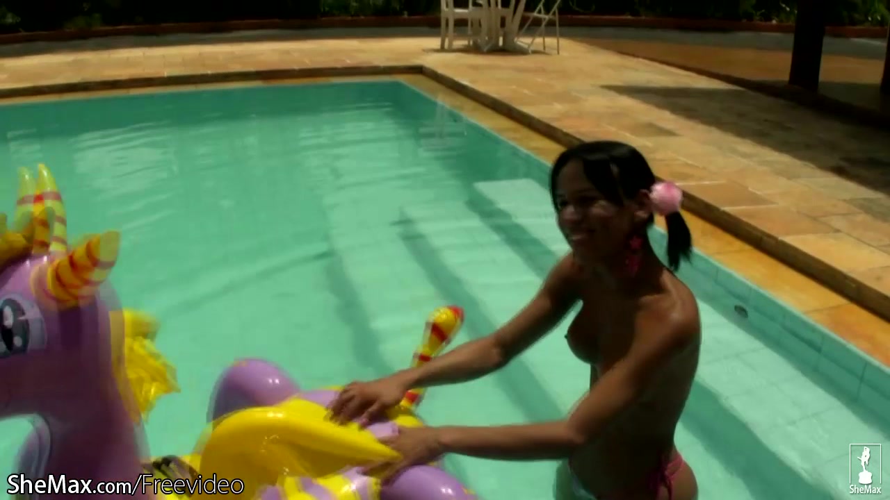 Cheerful teen shemale shows off sexy ass in thongs poolside